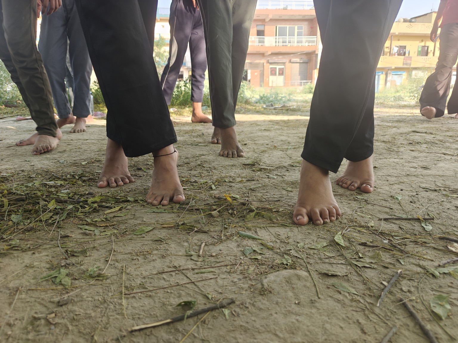 Movement and memory workshop with participants standing barefoot
